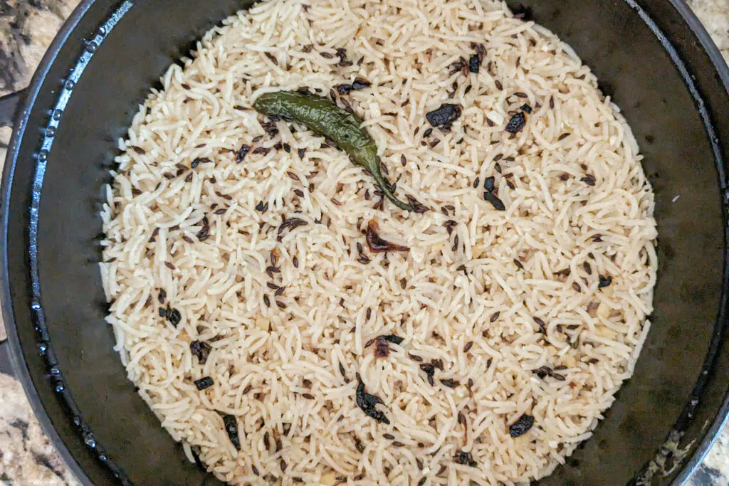 Rice resting after cooking to absorb the extra moisture.
