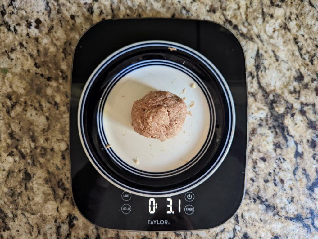 Ground turkey on a weighing scale.