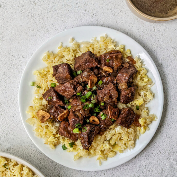 Beef brisket served over fried rice with clear broth.