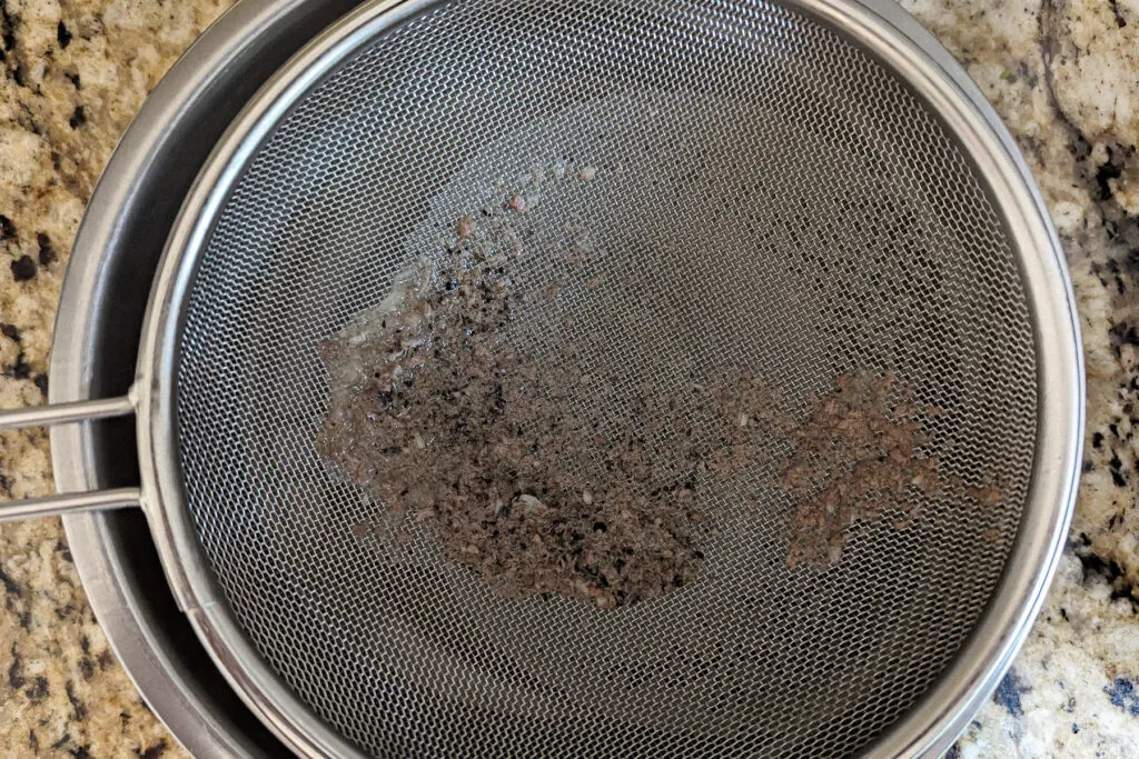 Broth strained through a mesh strainer. 