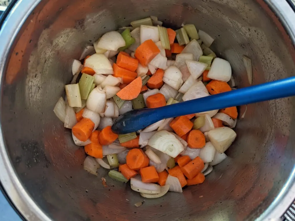 Onion, celery, carrots sautéing in the Instant Pot.
