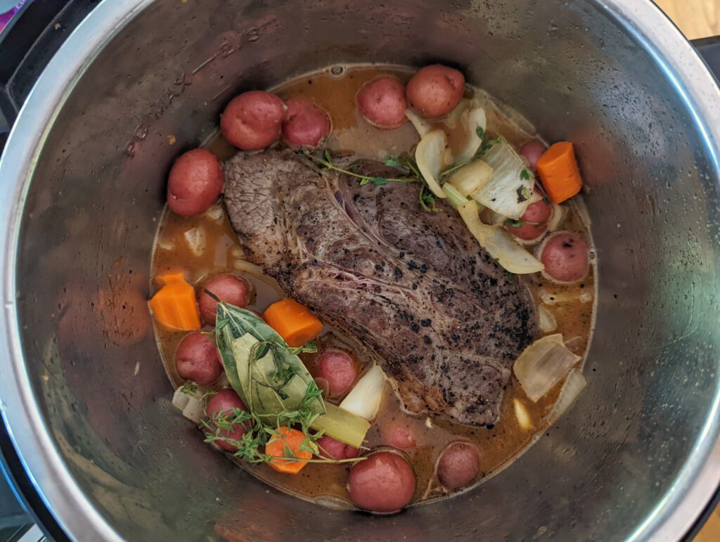 The beef nestled into the Instant Pot.