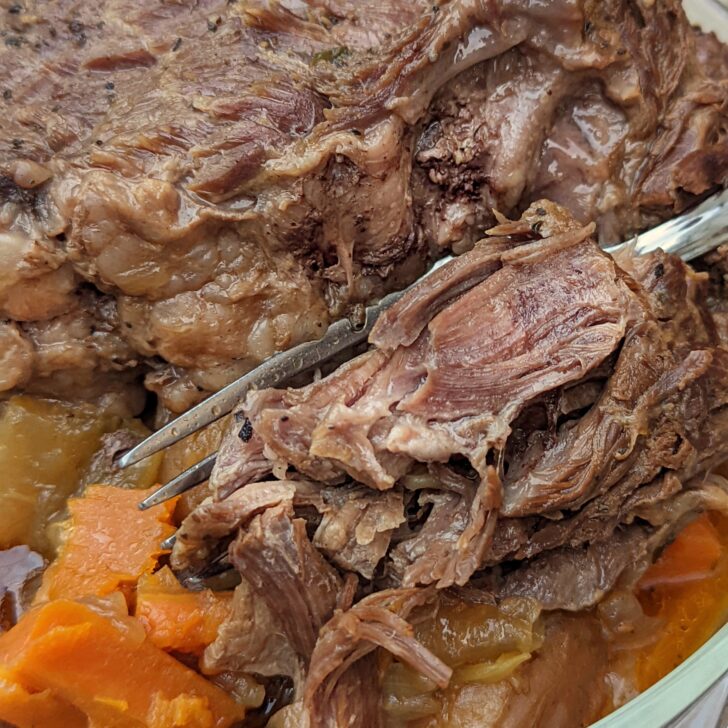 An up close picture of chuck roast being sliced.