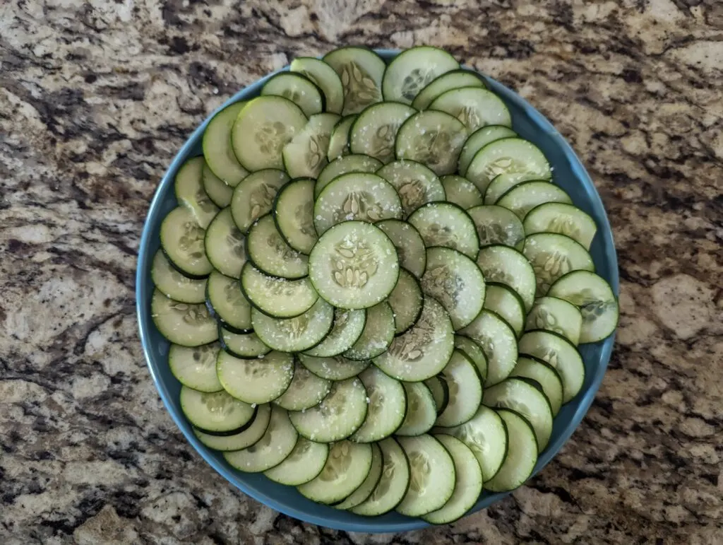 Salted cucumbers on a plate.