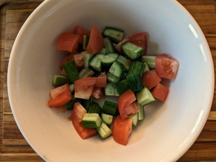 Cucumber and tomatoes in a bowl.