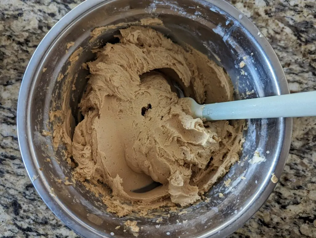 The frosting combined in a mixing bowl.