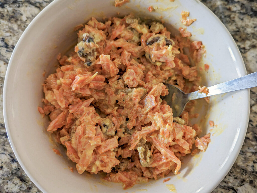 Cooked Carrots added to the garlic yogurt sauce.