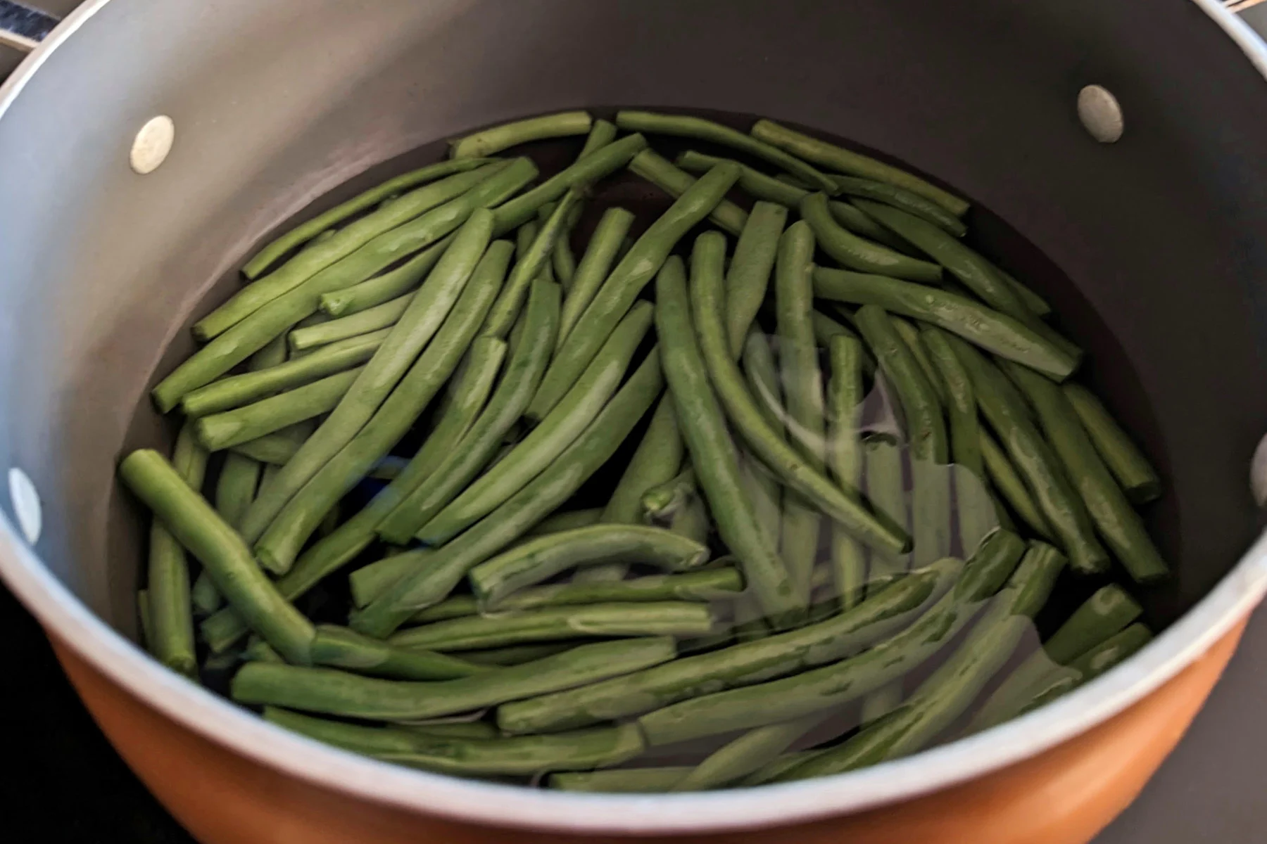 Green beans boiling in water.