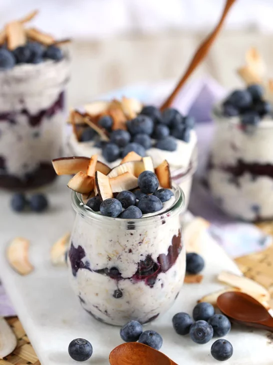 Oats layered with blueberry filling and topped with blueberry and large coconut flakes. 