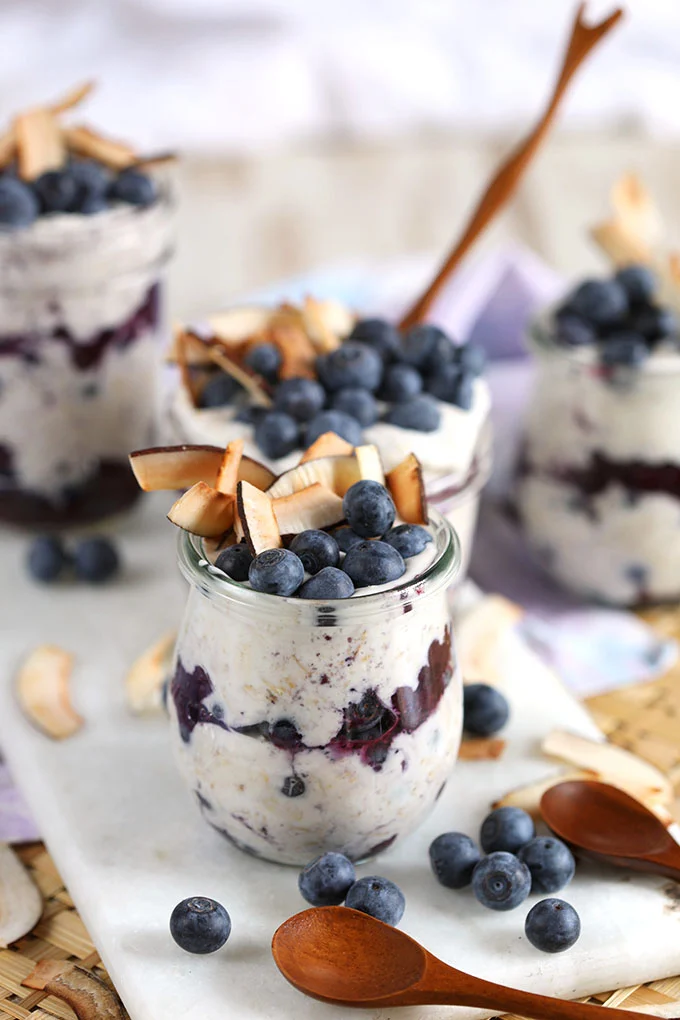 Oats layered with blueberry filling and topped with blueberry and large coconut flakes.