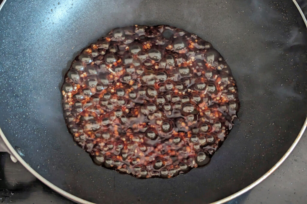 Sauce cooking in a wok.