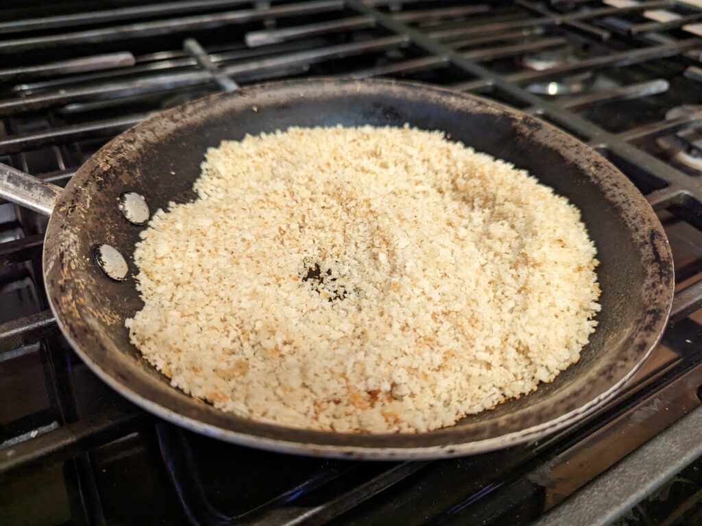 Panko toasting in a skillet.