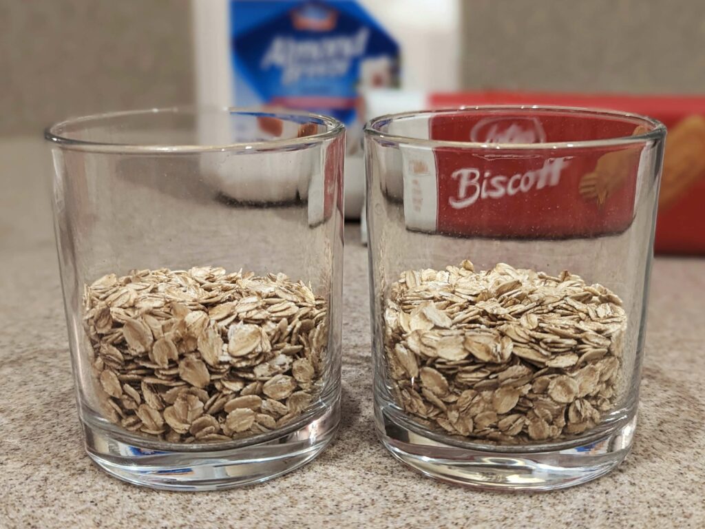 Oatmeal divided into two cups.