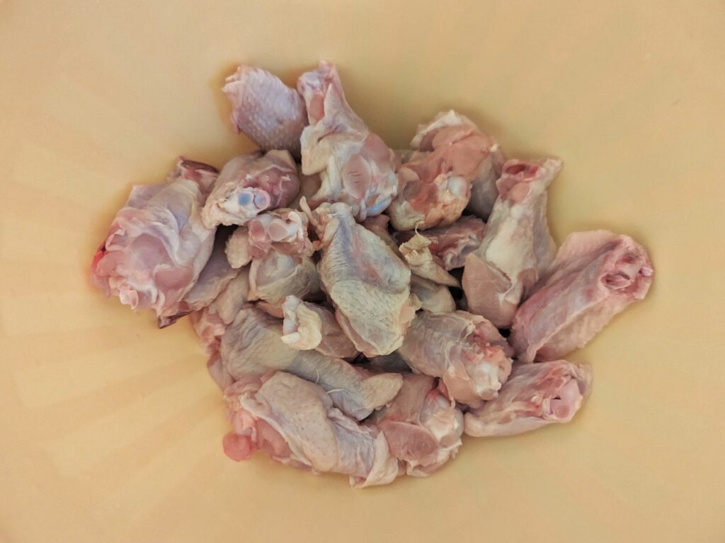 Chicken wings drying in a bowl.