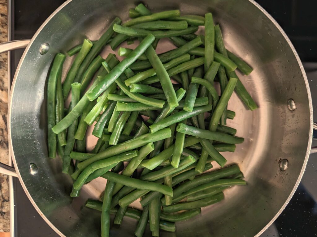 Green beans sautéing in butter.