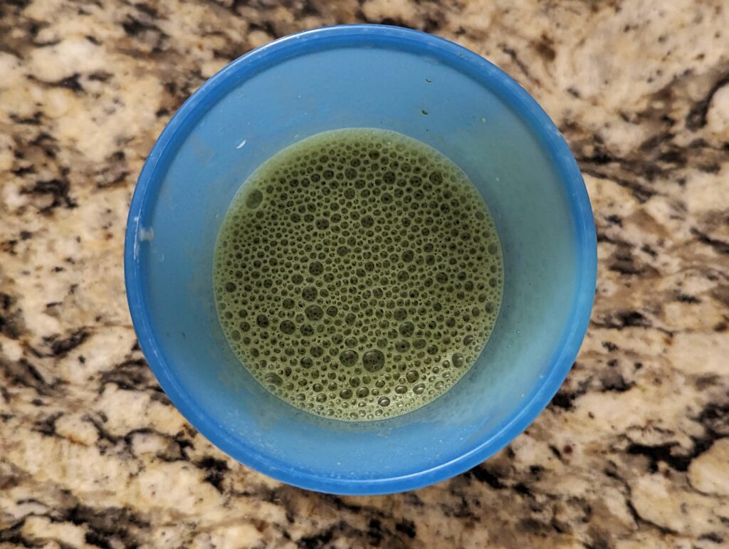Milk added to the matcha mixture.