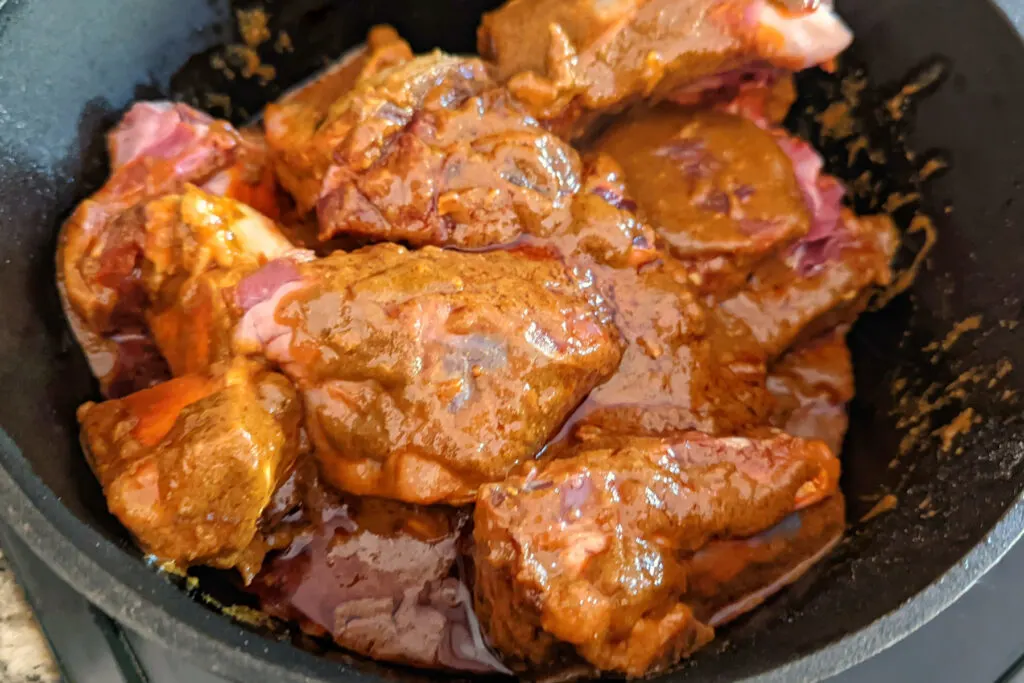 Beef nestled into the pot.