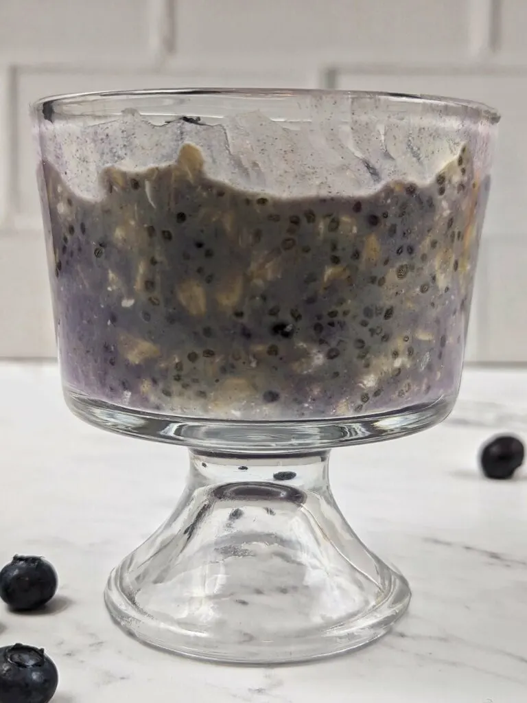 Overnight oats with frozen fruit and topped with fresh blueberries.
