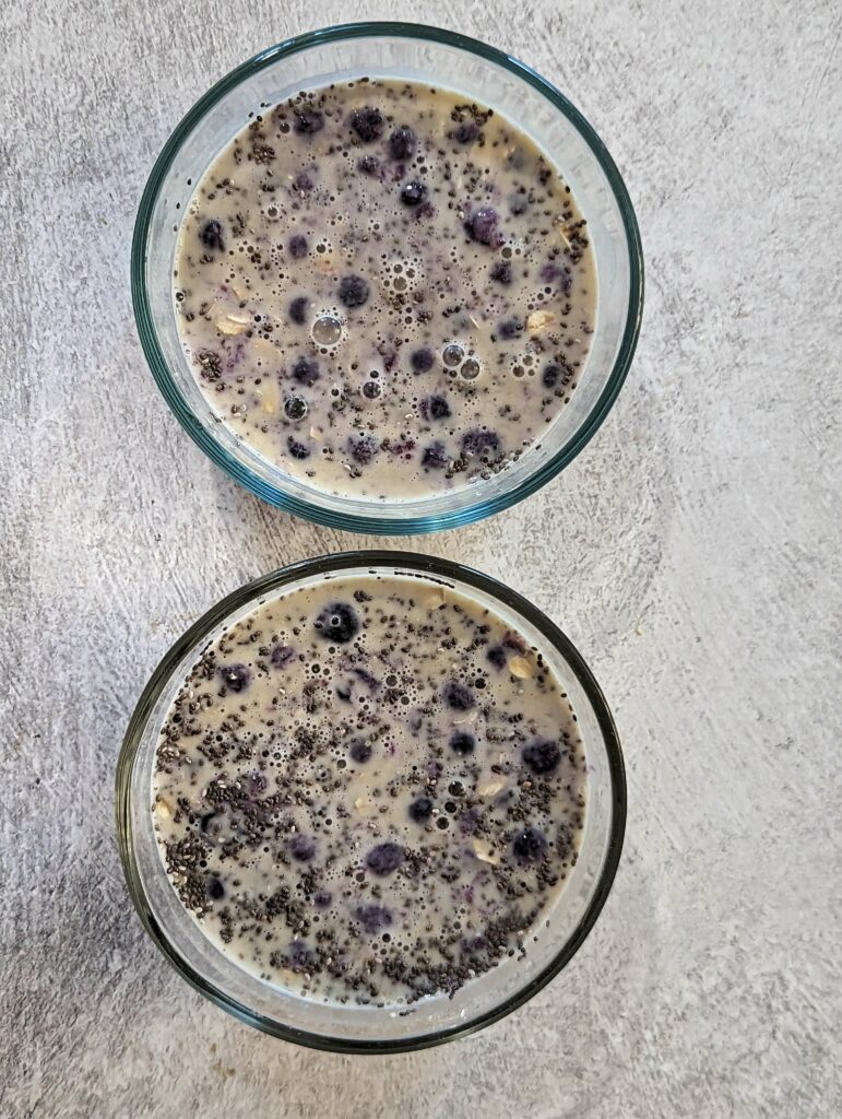 Milk and protein powder combined with the oats, chia seeds, and blueberries.