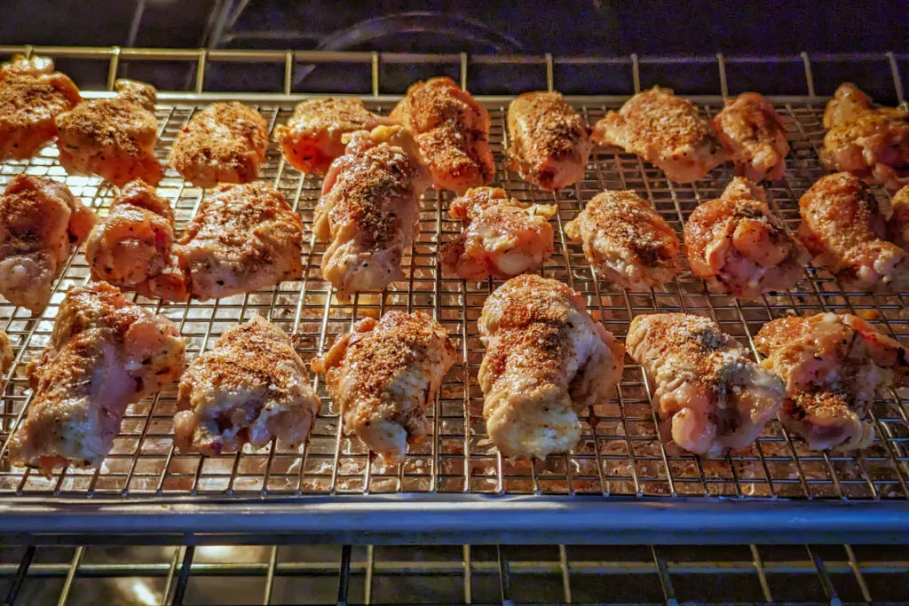 Chicken wings baking in the oven.