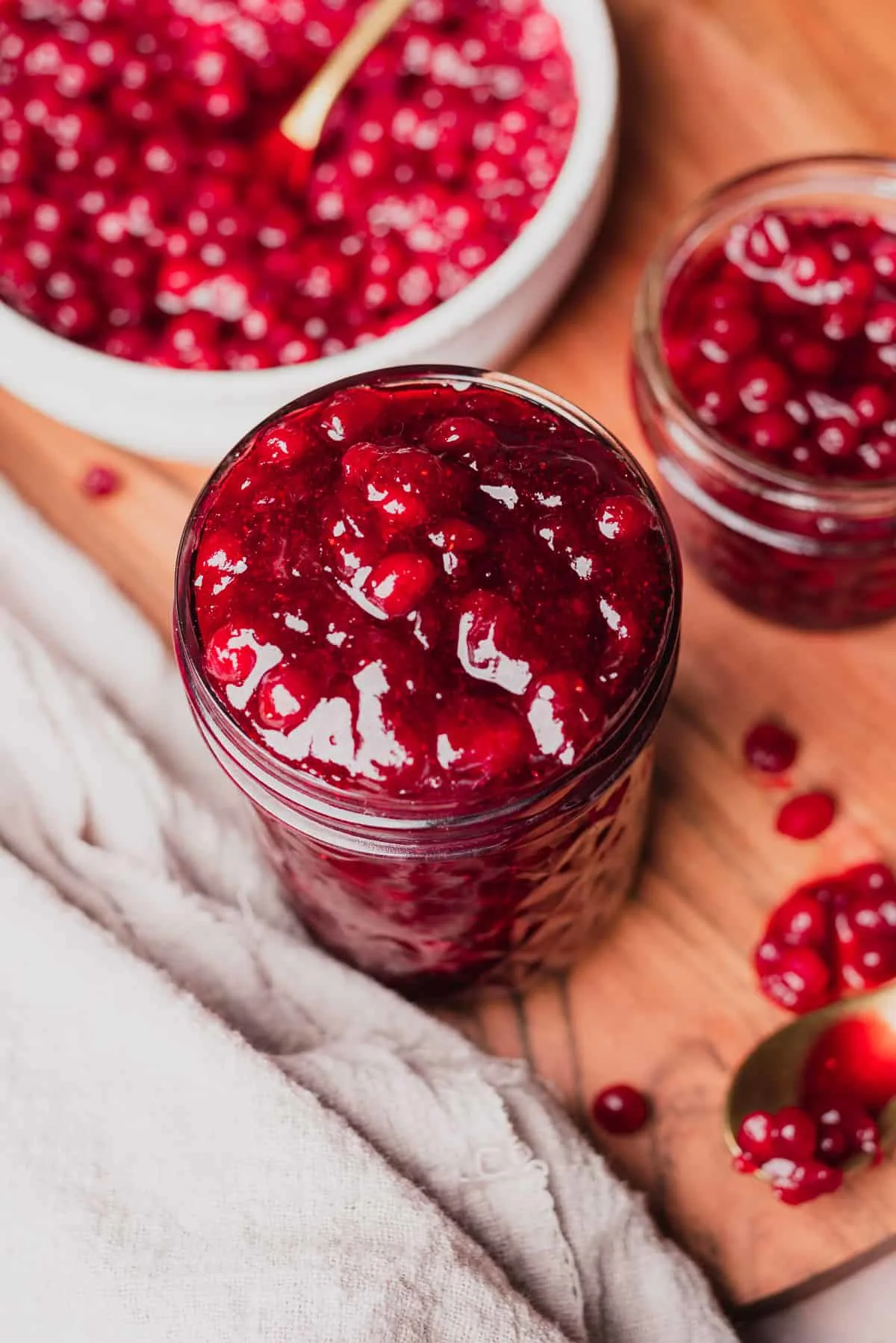 Two jars of lingionberry jam.