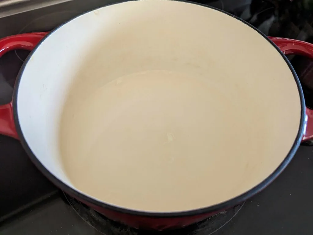 Coconut milk boiling in a pan.