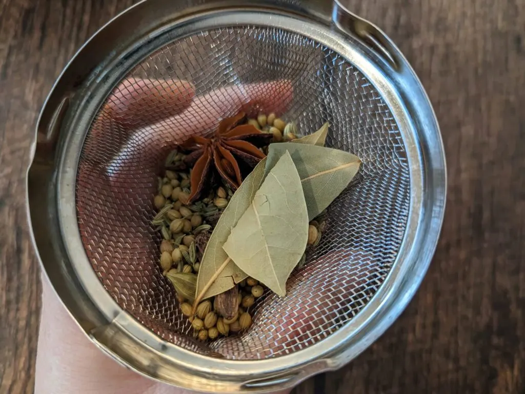 Whole spices in a spice ball.