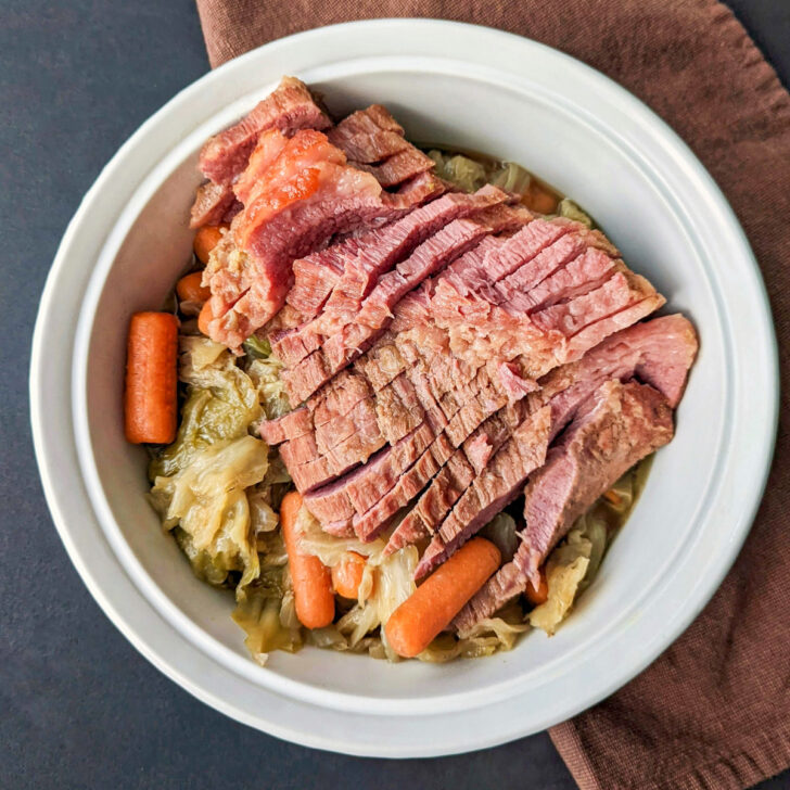 Dutch Oven Corned Beef and Cabbage in a serving dish.