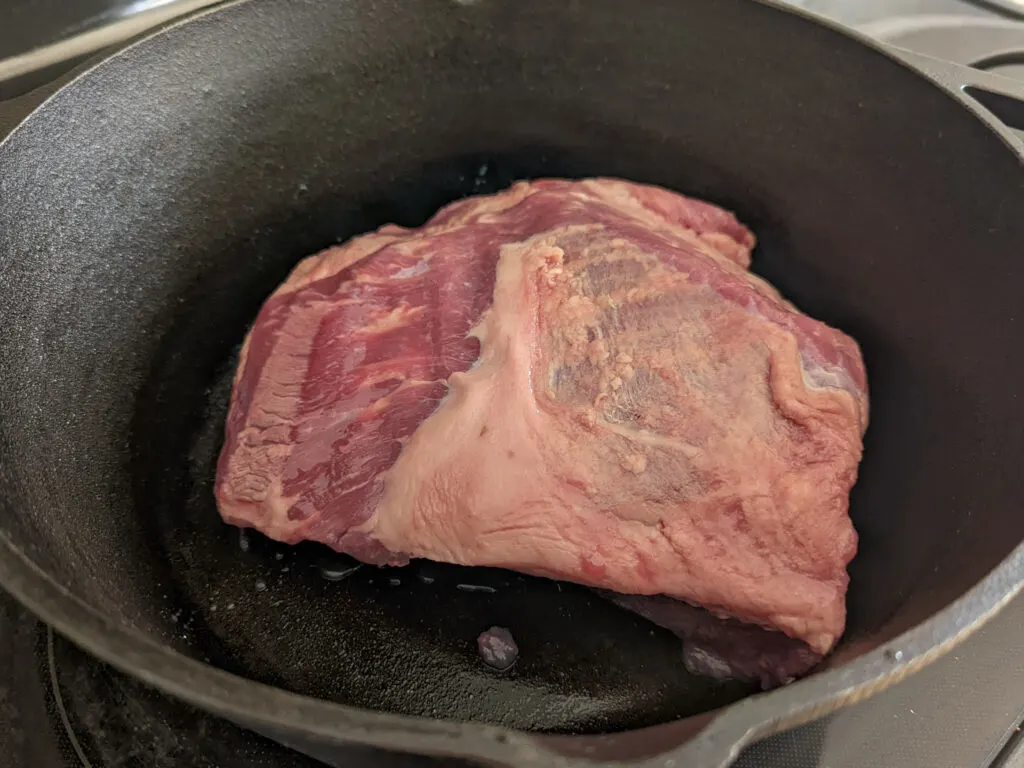 A brisket added to the center of a dutch oven. 