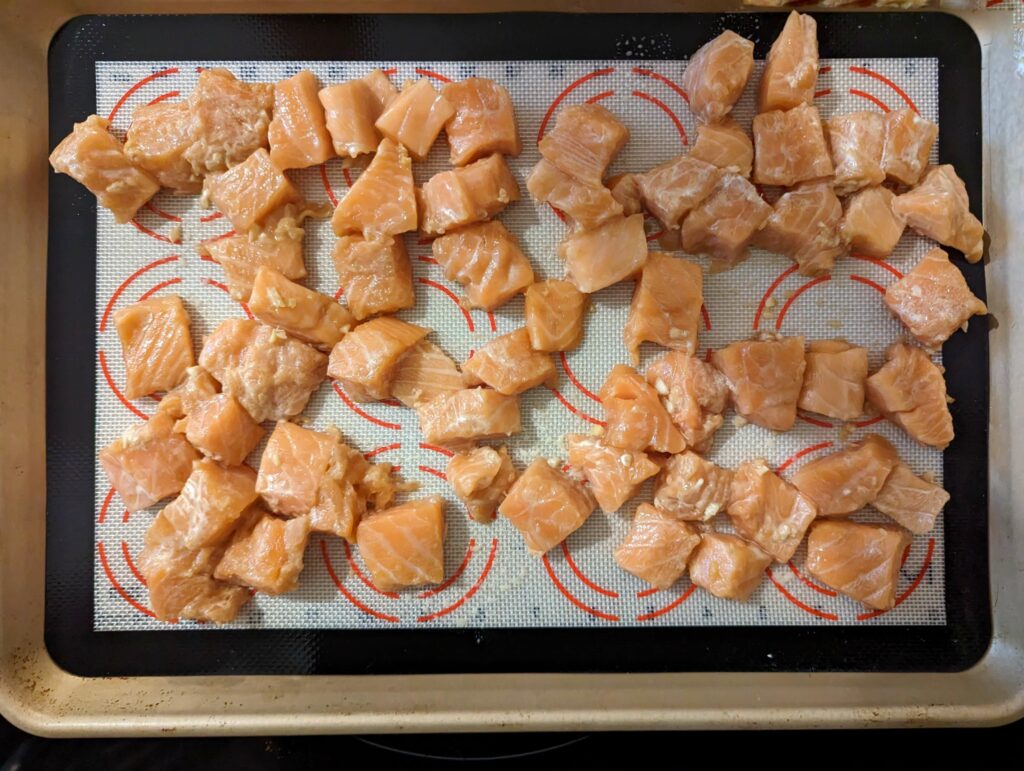 Arrange the salmon onto the baking sheet.