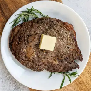 Air fryer ribeye steak on a plate.