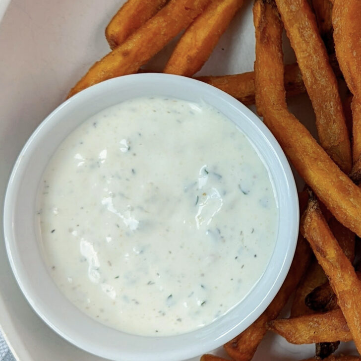 Ranch dressing in a serving cup.