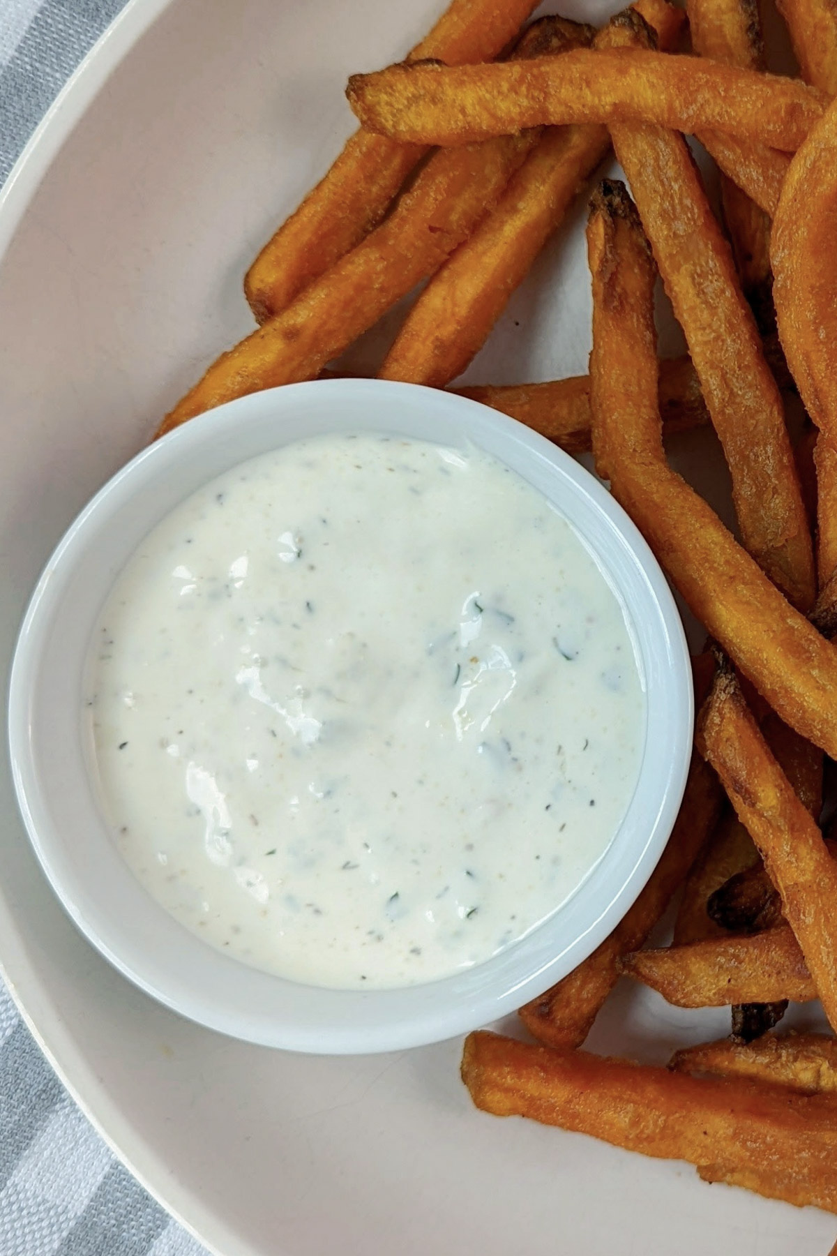 Ranch dressing in a serving cup.