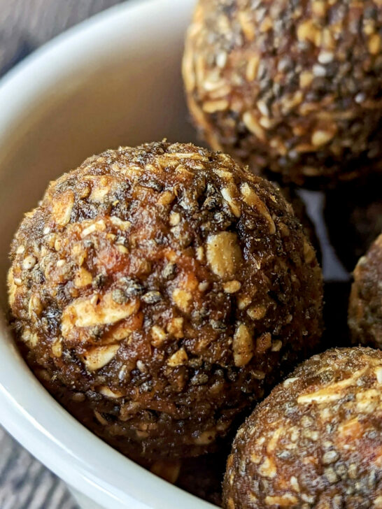 A small bowl filled with pumpkin protein balls.