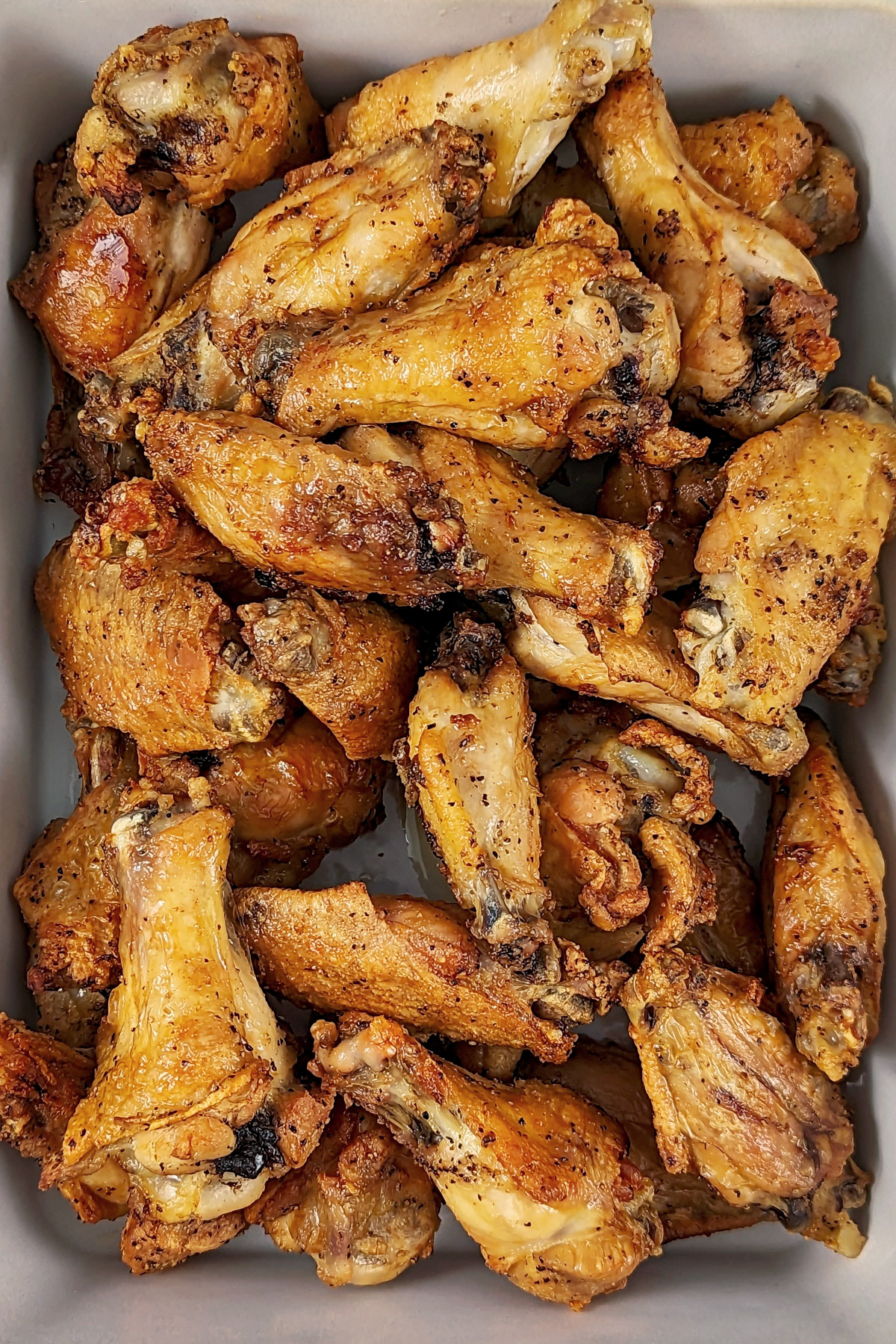 A serving dish of salt and pepper chicken wings.