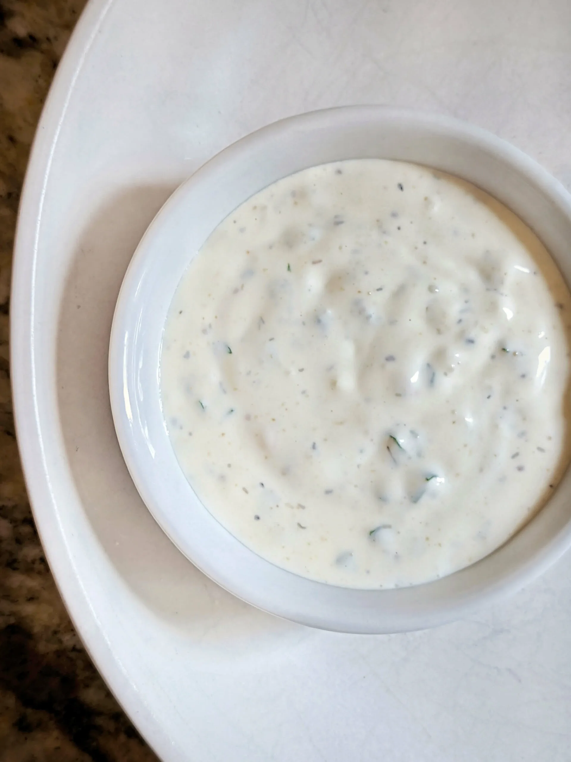 A close up of the Best Ranch Dressing Recipe in a serving dish.