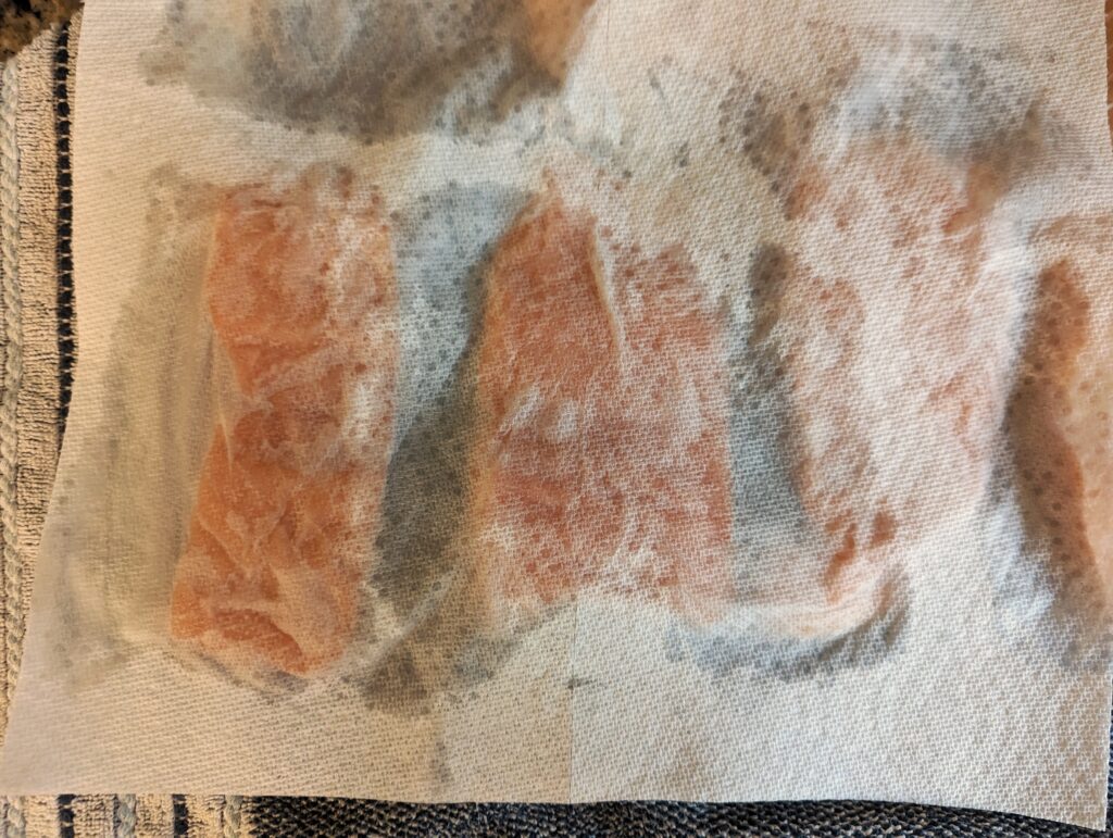 Pat dry the salmon fillets.