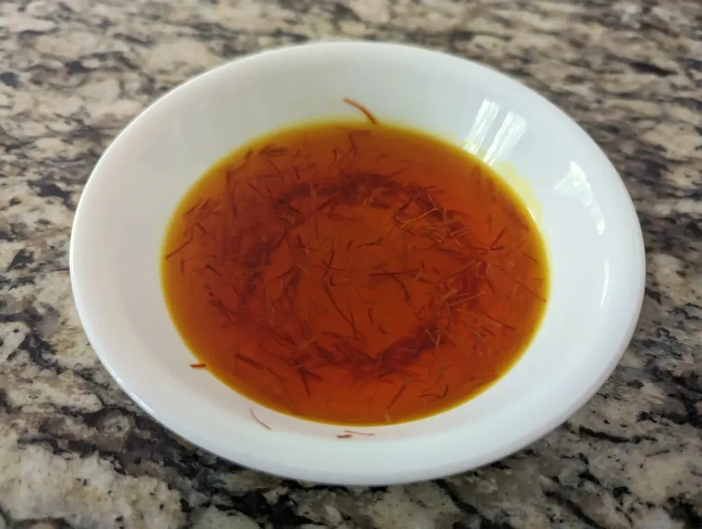 Saffron blooming in a small bowl.