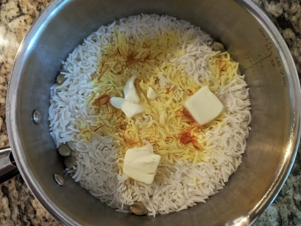 Butter infusing with the saffron rice.