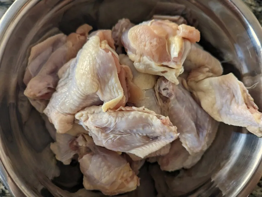 Dried wings in a mixing bowl.