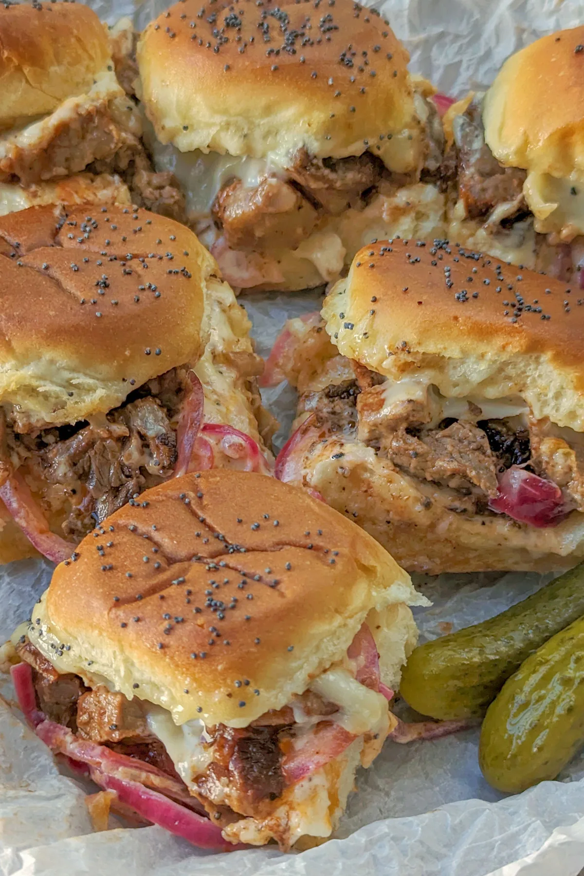 A serving tray of brisket sliders.