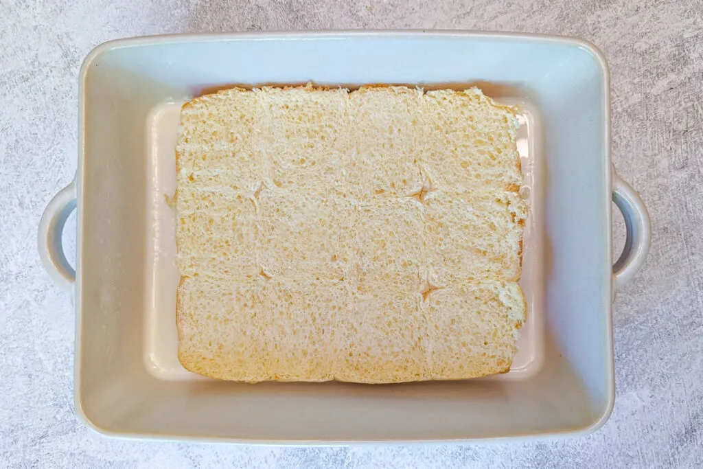 Sliced bread in a serving pan. 