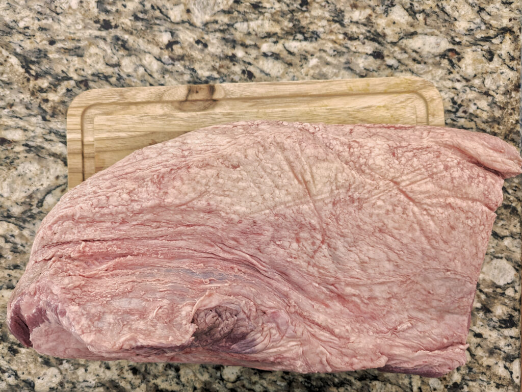 A trimmed brisket on the countertop.