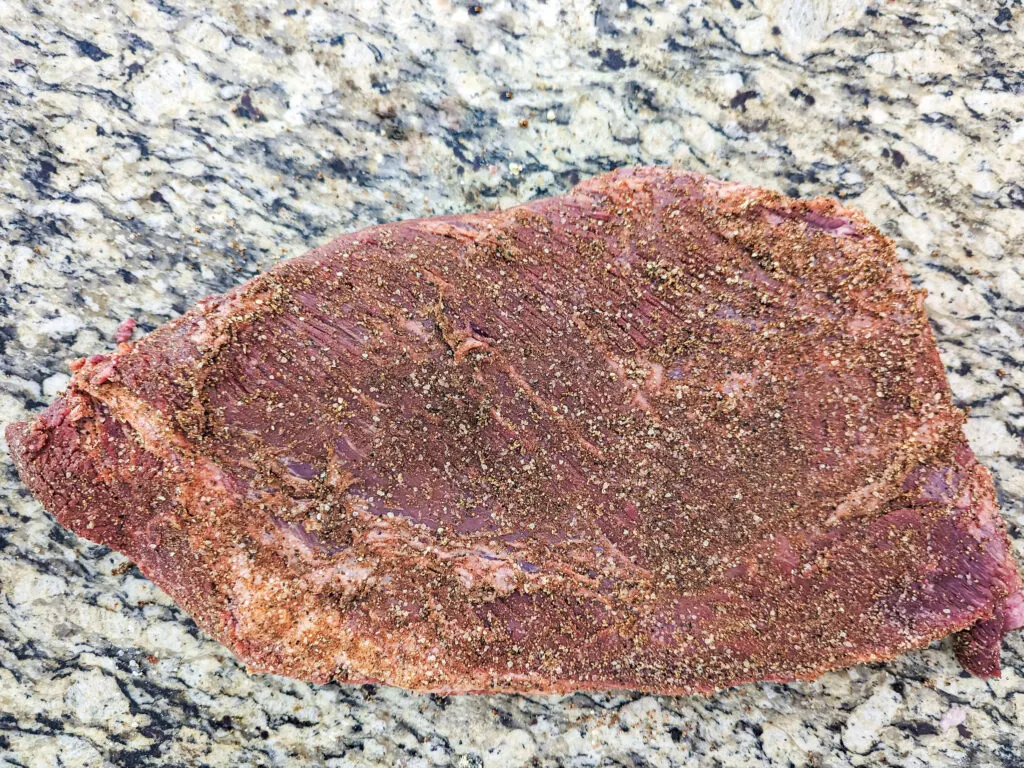 A seasoned and trimmed brisket.