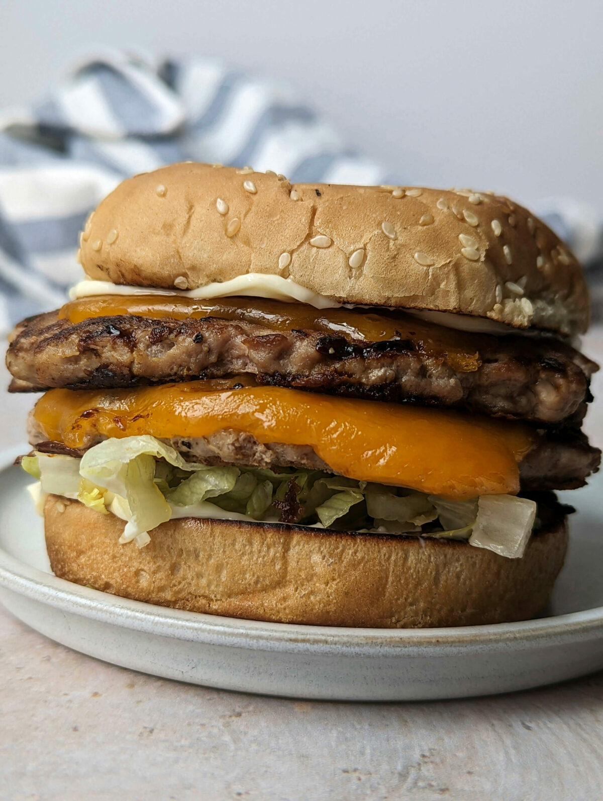 A close up of a double decker turkey smash burgers.