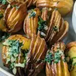 A close up of air fryer hasselback potatoes.