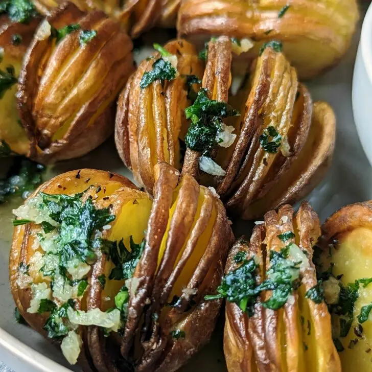 Air fryer hasselback potatoes on a plate.