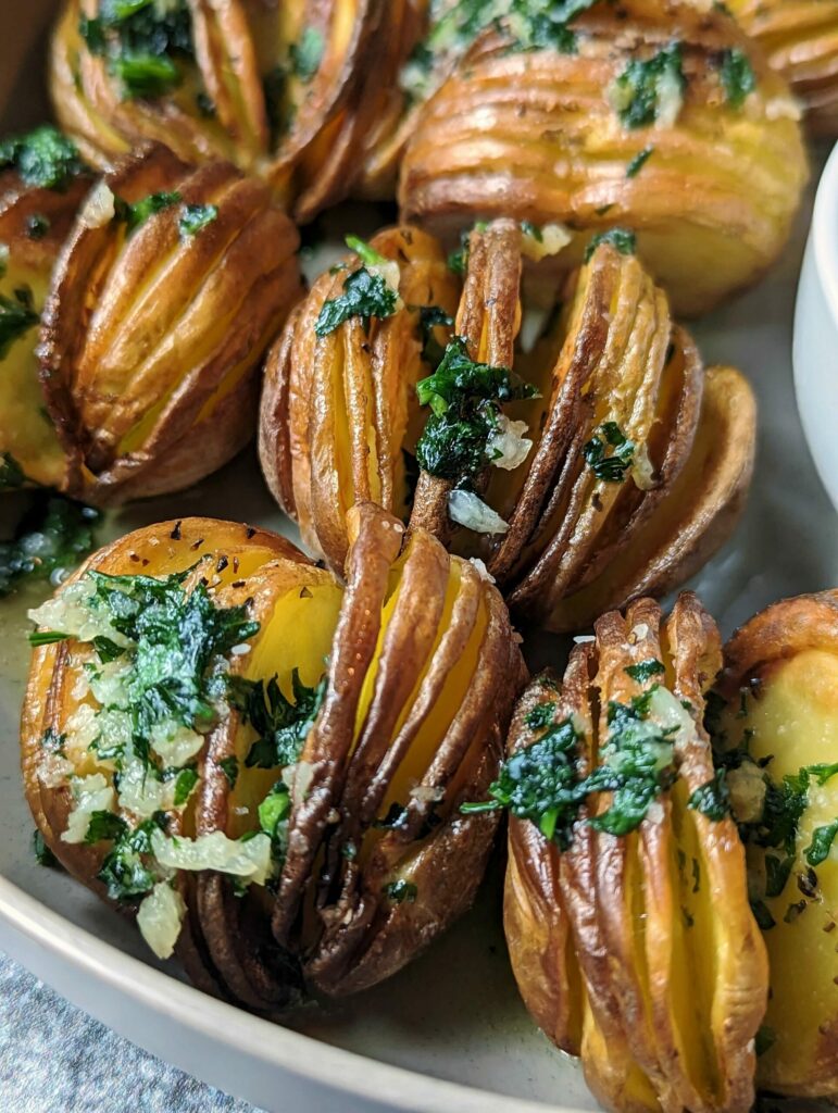 Air fryer hasselback potatoes on a plate.