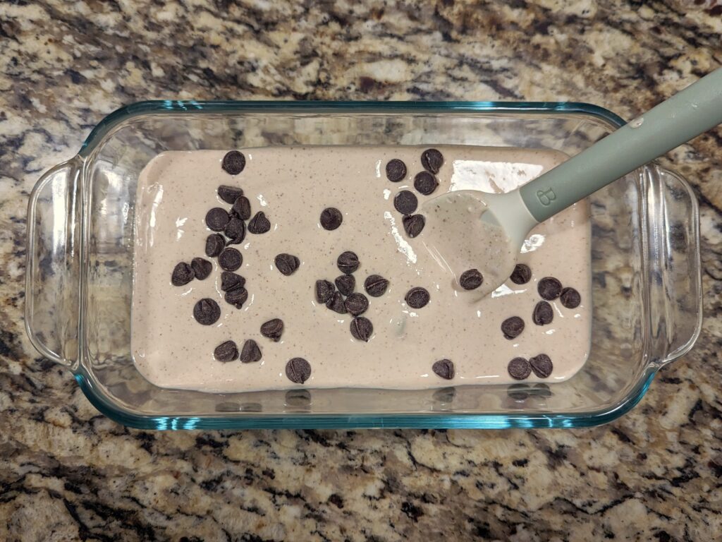 Stir the chocolate chips in the container.