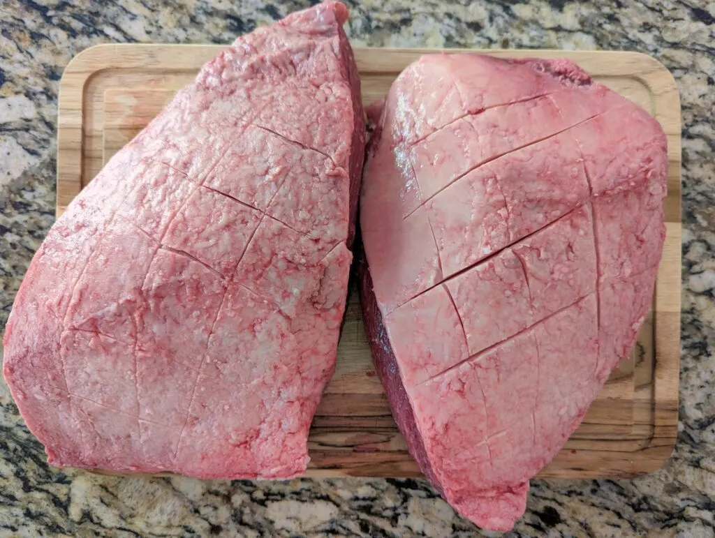The triangular steaks scored lightly with a knife.